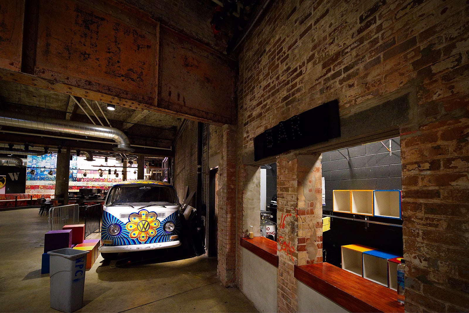 Large steel beams and exposed brick wall from the original structure are visible in the Fillmore's main lobby. (Bastiaan Slabbers for PlanPhilly)