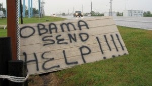 About a month ago, a sign in coastal Louisiana pleading for federal help after the BP oil spill echoed the signs that dotted New Orleans after Hurricane Katrina. Photo Credit: WGNO