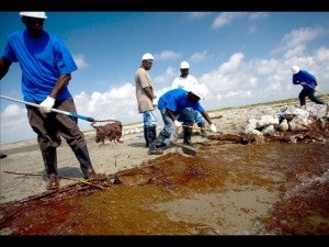 A cleanup crew paid by BP working to remove oil from a beach on Elmer Island, Louisiana, last month.