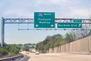 A road sign for Interstate 476