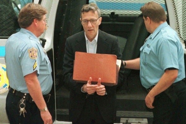 Murder suspect Thomas Capano is led into the courthouse by Corrections officers, for the third day of jury selection in Wilmington Del., Thursday, Oct. 8, 1998. Capano was convicted of murder charges in the death of Delaware gubernatorial secretary Anne Marie Fahey in 1996. (AP Photo/Tim Shaffer, Pool)