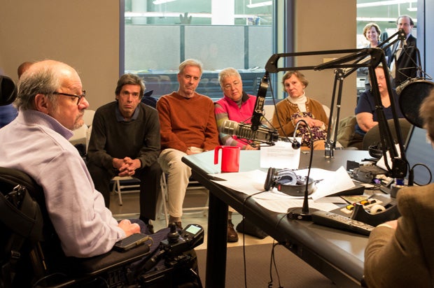 Dr. Dan Gottlieb (left) sits with live studio audience