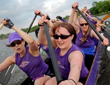 a The Schuylkill Dragons paddle on the Cooper River in New Jersey. They are in negotiations with the city of Philadelphia to build new docks that would allow them to return to the Schuylkill River. (Emma Lee/for NewsWorks)
