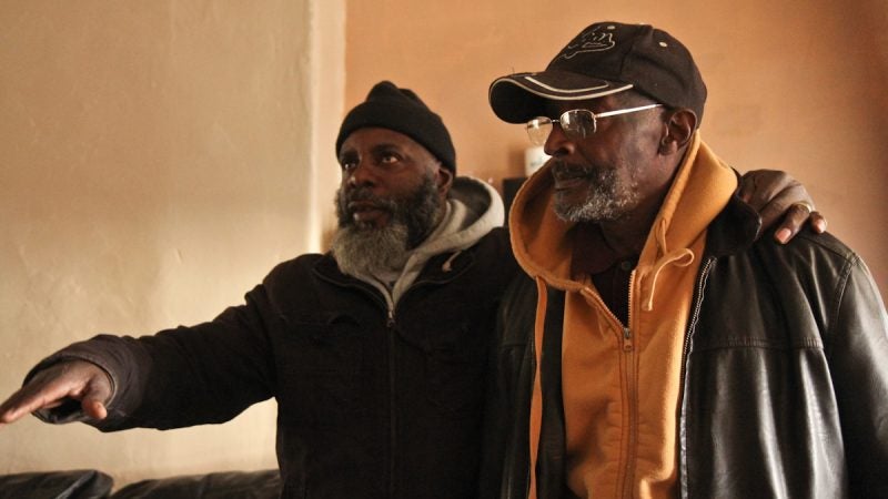 Activist Lamont DeShields (right) said he had never heard the neighborhood called Swampoodle until 2016. (Kimberly Paynter/WHYY)