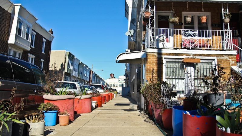 A street in Swampoodle off of Allegheny Avenue is lined with pots. (Kimberly Paynter/WHYY)