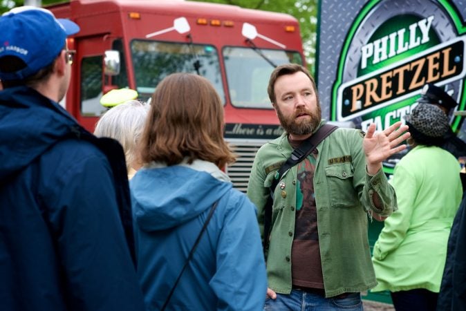 West Mt Airy Resident Bradley Maule guides a neighborhood walk themed Love-City-Nature that finished at Mt Airy Day. (Bastiaan Slabbers for WHYY)