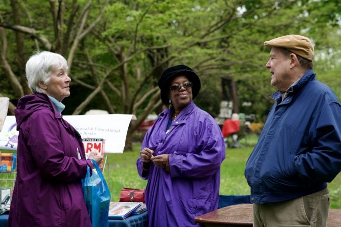 West Mt Airy residents Peggy and Rob McGregor chat with Deborah Gary (middle), a business owner from the 6300 block of Germantown Ave. (Bastiaan Slabbers for WHYY)