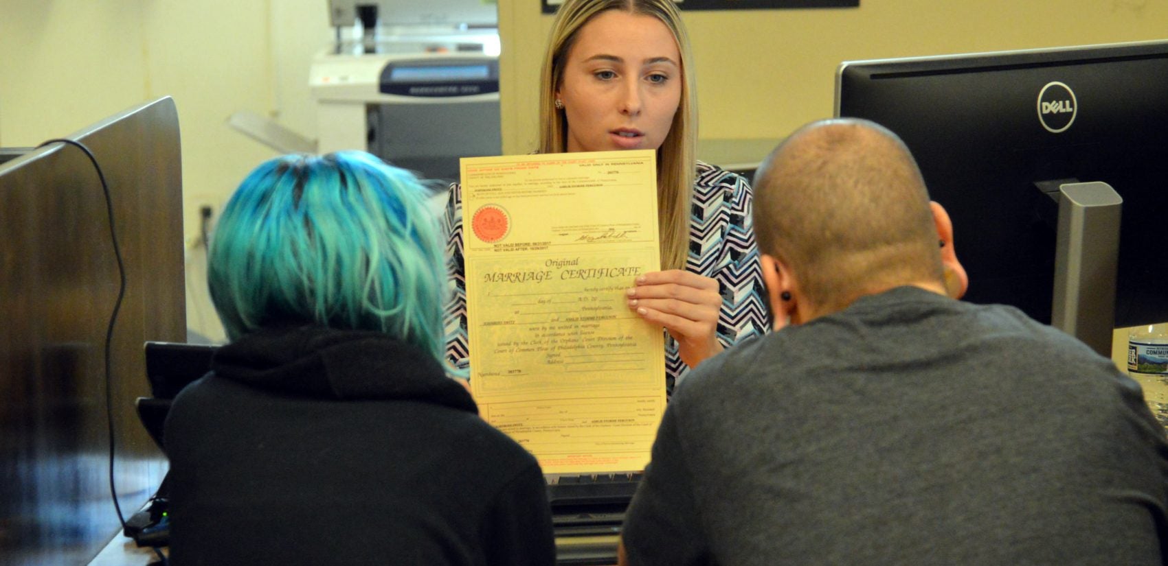 Lindsey Keenan talks marriage licenses with Ashley Ferguson and JohnRoss Switz. (Tom MacDonald/WHYY)