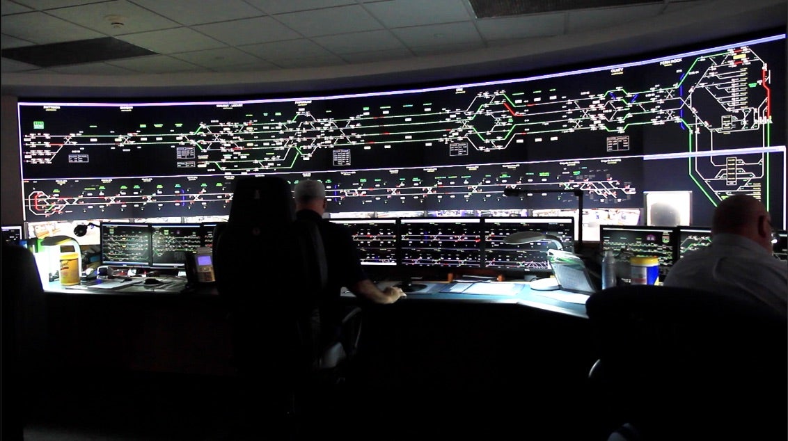 In SEPTA's control room, monitors keep tabs on bus and train routes, platforms. (Kimberly Paynter/WHYY)