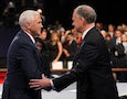 Mike Pence and Tim Kaine shake hands