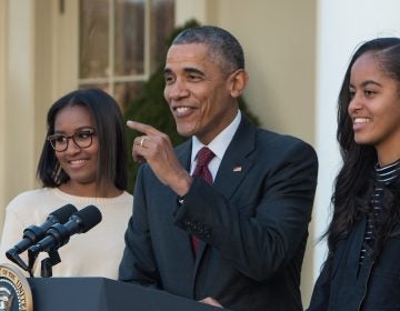 President Barack Obama with daughters Sasha (left) after Malia at his side, after 