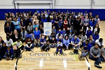  Students and staff gathered for a group photo to celebrate World Autism Awareness Day at Green Tree School & Services on Wednesday. (Bas Slabbers/for NewsWorks) 