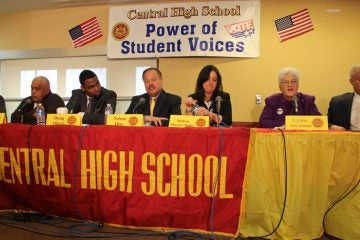 Mayoral candidates (from left) Jim Kenney, Milton Street, Doug Oliver, Nelson Diaz, Melissa Murray Bailey, Lynne Abraham and Anthony Williams participate in a forum at Central High School. (Emma Lee/WHYY)