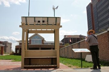 The Village Green bench is a solar and wind powered data collection station that gathers and disseminates weather and air quality information. It is located on Independence Mall near 6th and Arch streets. (Emma Lee/WHYY)