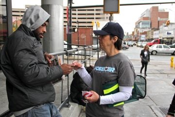 Patty DiRenzo distributes information about a New Jersey law that protects those who report drug overdoses from prosecution for drug crimes. DiRenzo's son died of an overdose in 2010. (Emma Lee/WHYY)