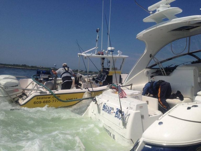  Sea Tow and the New Jersey State Police help secure a 40-foot pleasure boat that became stuck on a submerged jetty off Barnegat Light Saturday morning.  