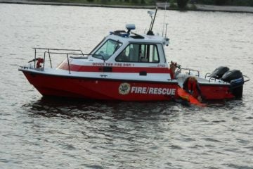 10511580_342462572570541_961423400448736955_o Rescuers assist two sailors from the the bay off Toms River early Sunday evening. (Photo courtesy of the Ocean Beach Volunteer Fire Company)