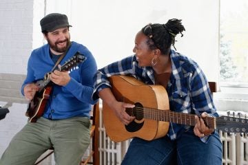 Adam Monaco and Danie Ocean, the Co-Executive Directors of Working While Playing in a Blue-grass jam session. (Bastiaan Slabbers/for NewsWorks)