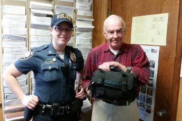  Ptlw. Sarah Collins and Ray McCarthy at Surf City Police Department headquarters today. (Photo courtesy of the Surf City Police Department) 