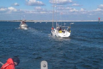  A Coast Guard vessel approaching the Barnegat Inlet today with a 42-foot disabled sailboat in tow. (Photo courtesy of the U.S. Coast Guard Station Barnegat Light) 