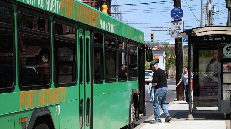  A passenger boards a Port Authority of Allegheny County bus in Pittsburgh.   (Ryan Loew/WESA) 