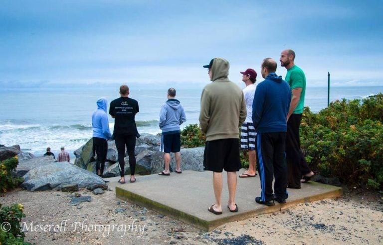 Surfers checking conditions at a Deal Borough beach entrance in an undated photo. (Photo: Russ Meseroll‎ Photography) 