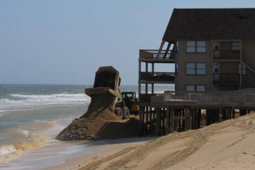A dump truck unloads sand in Ortley Beach in April 2016. (Photo courtesy of Toms River Township)