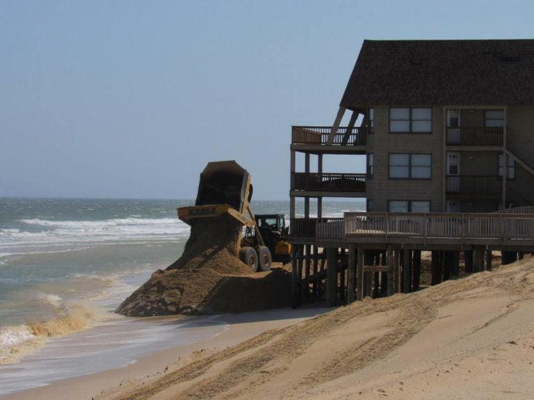 A dump truck unloads sand in Ortley Beach in April 2016. (Photo courtesy of Toms River Township)