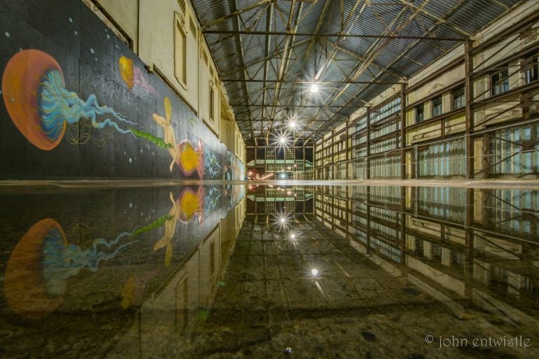 The Asbury Park Casino building reflecting in a puddle just after the rain passed through overnight. (Photo: John Entwistle)