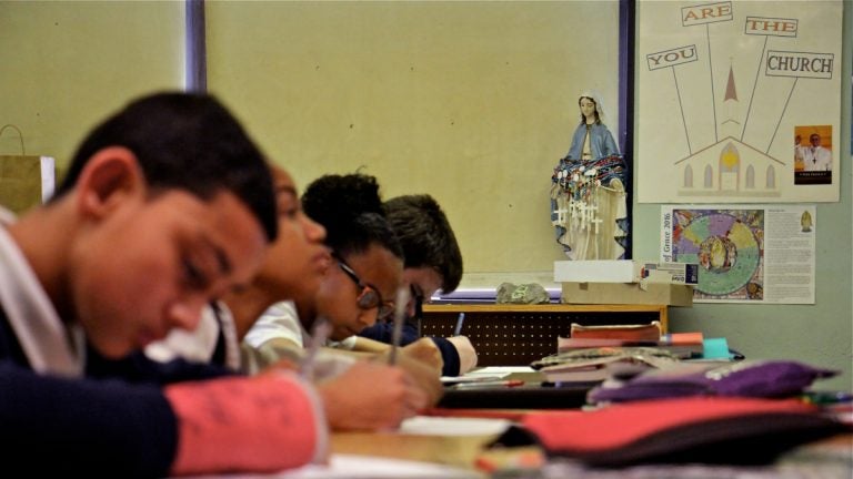 Students in Elaine Carboni's 8th grade class at Saint Gabriel School take a vocabulary test. (Emma Lee/WHYY)