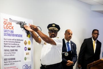 Philadelphia Sheriff Jewell Williams explains how gun locks are used and how they might help prevent accidental shootings. (Brad Larrison for NewsWorks)