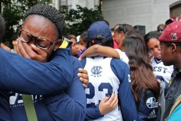 Students and alumni of West Catholic High School mourn the death of 18-year-old Akyra Murray, a recent graduate and basketball standout who was vacationing with her family in Orlando when she was killed at the Pulse night club. (Emma Lee/WHYY)