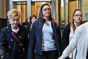  Kathryn Knott, center, leaves court Tuesday. The jury will now decide whether she is guilty in the assault of a gay couple in Center City in 2014. (Kimberly Paynter/NewsWorks) 