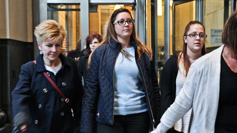  Kathryn Knott, center, leaves court Tuesday. The jury will now decide whether she is guilty in the assault of a gay couple in Center City in 2014. (Kimberly Paynter/NewsWorks) 