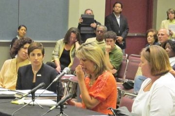 20130815-sandy-hearing-1200 Simone Dannecker (center) and Lee Ann Newland (right) voice concerns about the grant application process at legislative hearing in Atlantic City.(Phil Gregory/for NewsWorks)