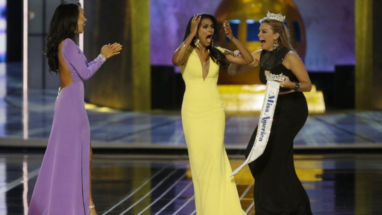  Miss New York Nina Davuluri, center, reacts after being named Miss America 2014 pageant as Miss California Crystal Lee, left, and Miss America 2013 Mallory Hagan celebrate with her. (AP Photo/Mel Evans) 