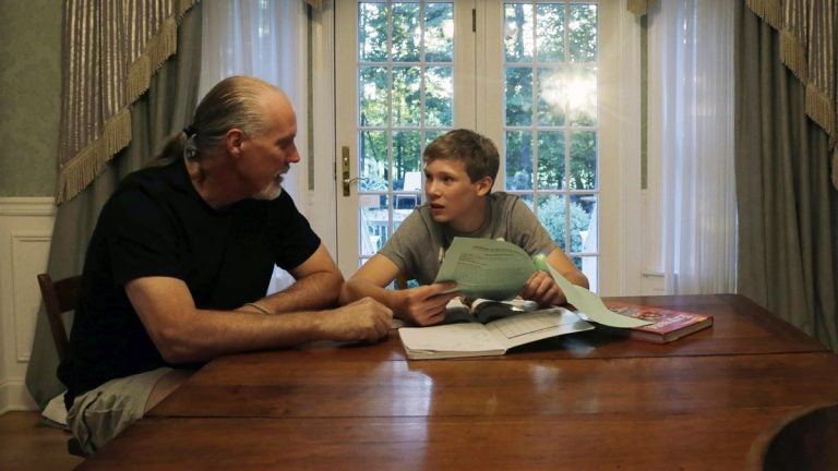 Will Richardson (left) and his son Tucker at their home in Flemington, N.J. Tucker's parents, Wendy and Will, are part of a small but growing number of parents nationwide who are ensuring their children do not participate in standardized testing.  (AP Photo/Mel Evans) 