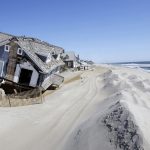  In April 2013, homes severely damaged by Superstorm Sandy line the beach in Mantoloking, N.J.  (AP Photo/Mel Evans, File) 