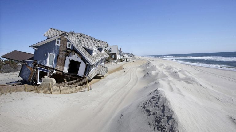  In April 2013, homes severely damaged by Superstorm Sandy line the beach in Mantoloking, N.J.  (AP Photo/Mel Evans, File) 