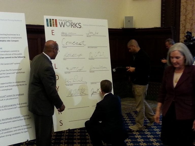 Mayor Nutter watches as executives sign pledge