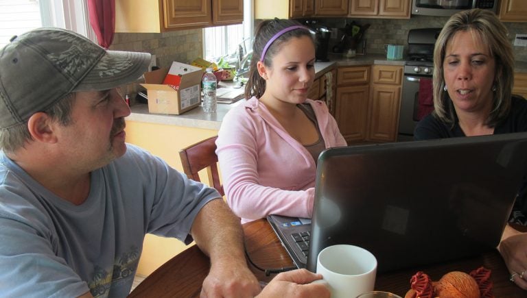  Ken Dannecker, left, his daughter Nicole, center, and wife, Simone, right, in their Union Beach home. The Danneckers rebuilt their storm-damaged house without waiting for insurance or government aid because they feared mold would overrun it. (AP Photo/Wayne Parry) 