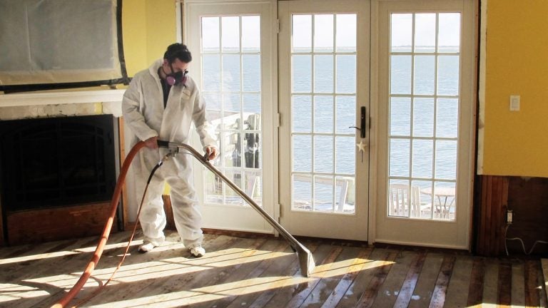  Victor Pena of Flag Enterprises steam-cleans a floor to remove mold.  (AP Photo/Frank Eltman, File) 