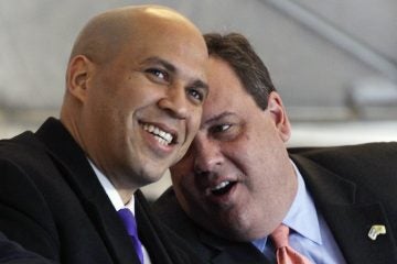  Feb 2012 photo of Newark Mayor Cory Booker with Governor Chris Christie. Booker championed many school reforms unpopular with the unions.  (AP Photo/Mel Evans) 