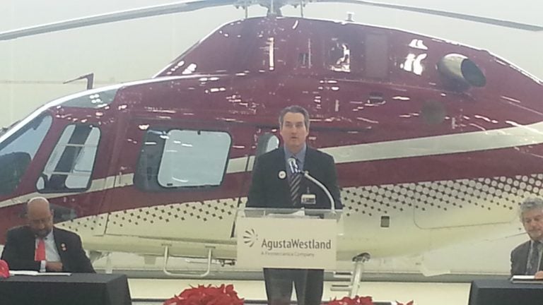  William Hunt of AgustaWestland stands in front of a $3.5 million helicopter his company built in Philadelphia (Tom MacDonald/for NewsWorks) 