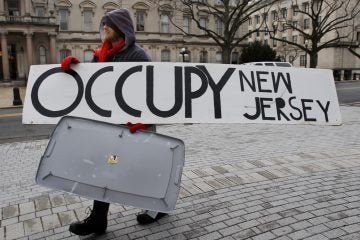 Dusty Hinz Dusty Hinz, of Philadelphia, outside the Statehouse in Trenton, N.J. Saturday. (AP Photo/Mel Evans)