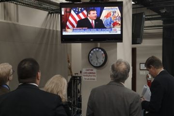  Inside the nation's Capitol a group watches Gov. Chris Christie on Jan 9 apologize for a four day traffic jam that happened on his watch.  (AP Photo/J. Scott Applewhite) 