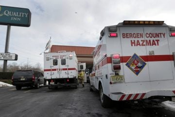  Emergency vehicles are parked outside a Quality Inn in Lyndhurst, N.J. (AP Photo/Charlie Riedel) 