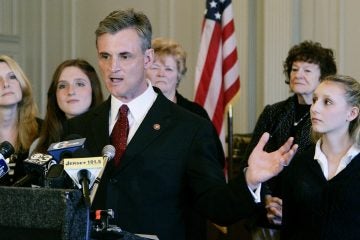  File photo from 2008 of New Jersey Rep. Robert Andrews, D-Camden, with his family, wife Camille Andrews, left, daughters Jacquelyn, second left, and Josie, right. (Mel Evans/AP Photo) 