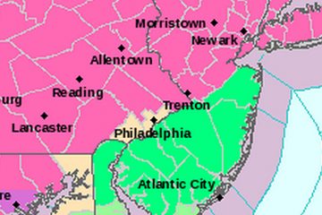  Pink areas are under a Winter Storm Warning. Green areas are under a Flood Advisory. (Image via National Weather Service) 