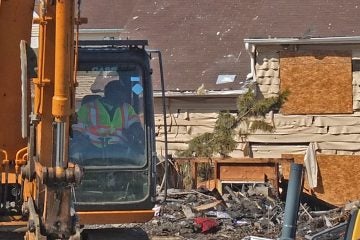  This nearby townhome shows signs of extreme  heat exposure. (Alan Tu/WHYY)  